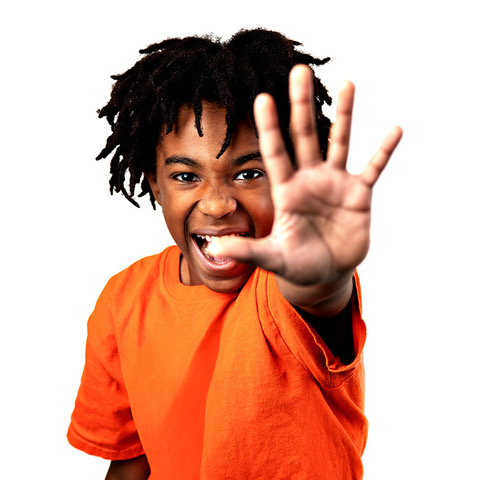 Boy with hand outstretched.